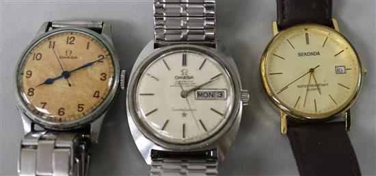 A gentlemans steel Omega Constellation wrist watch and two other watches.